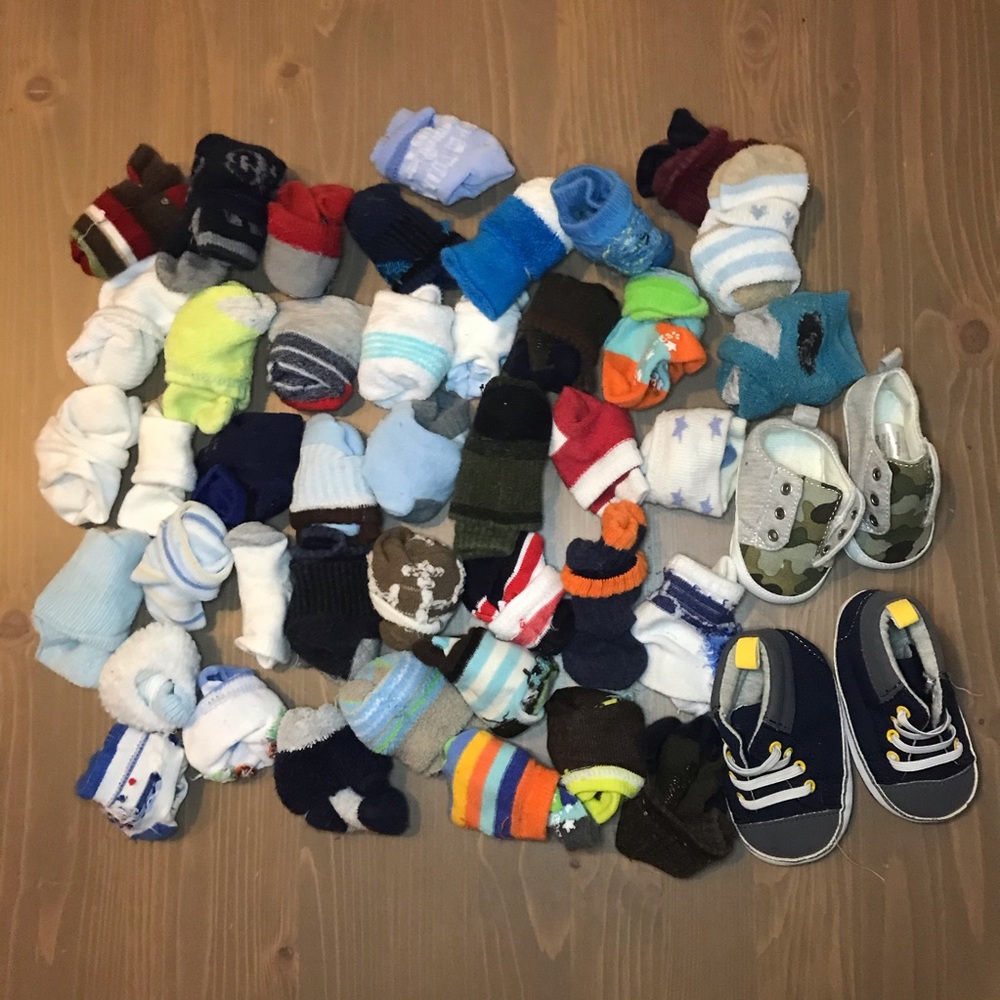 42 pairs of boy socks and 2 shoes